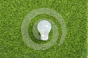 High angle shot of a led lamp on the grass texture