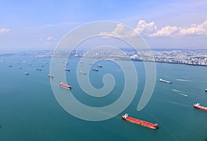 Ocean liner, tanker and Cargo Ship in Singapore Strait and Singapore city, See from plane. photo