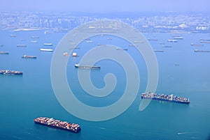 High angle shot of ocean liner, tanker and Cargo Ship in Singapore Strait. photo