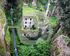 High angle shot of an old moss-covered building in the forest captured in Sorrento, Italy