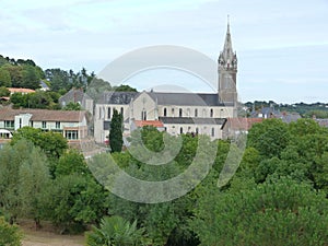 High angle shot of a park and a building with a tower in Ancenis, France