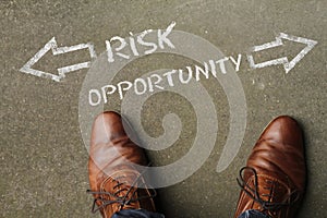 High angle shot of a person facing the dilemma of choosing either risk or opportunity