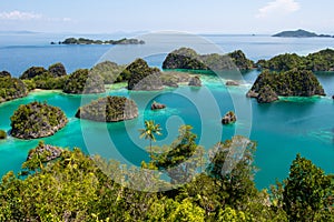 High angle shot of Piaynemo Natural Park in the ocean captured in Raja Ampat, Fam Islands photo