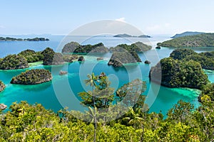 High angle shot of Piaynemo Natural Park in the ocean captured in Raja Ampat, Fam Islands photo