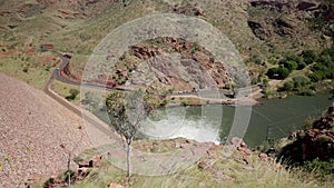 high angle shot of the power station outlet at the base of lake argyle dam