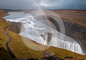 High angle shot of a rainbow over the Gullfoss waterfall in Iceland