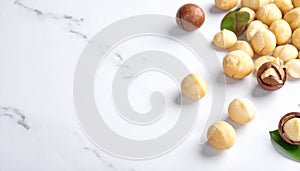 Macadamia Nuts on White Marble Background