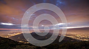 High angle shot of the sunset over the beautiful city lights captured in Hong Kong