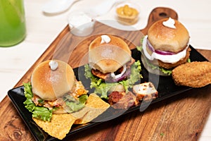 High-angle shot of three chicken miniburgers