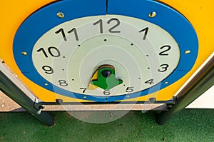 High angle shot of a toy clock in the playground