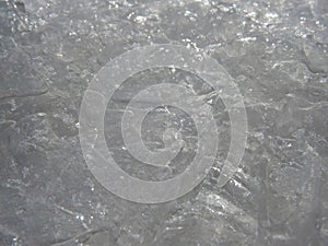 High angle shot of an unsmooth ice ground - perfect background texture photo