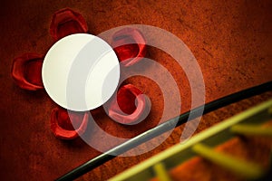 High angle shot of a white round table with red chairs