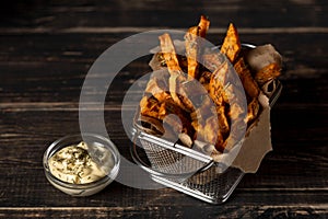 High angle sweet potato fries with sauce. High quality and resolution beautiful photo concept