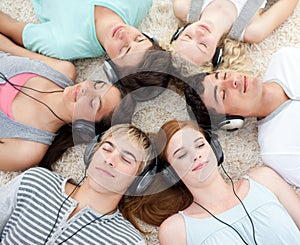 High angle of teenagers listening to music