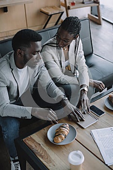 high angle view of african american businesspeople discussing work during business meeting