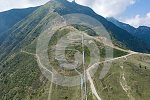 Aerial drone shot view of Alpine Coaster Bobsleigh track on Monte tamaro hills in Ticino, Switzerland