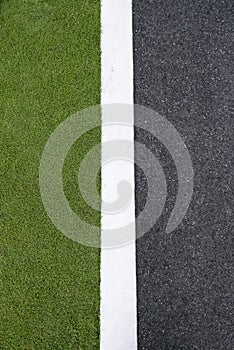 High angle view of asphalt of street and grass
