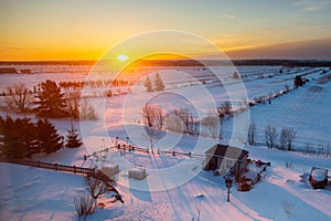 High angle view of beautiful sunrise on snowy fields seen during an early morning winter,