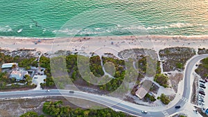 High angle view of Blind Pass beach on Manasota Key in Englewood, USA. People enjoying vacations time swimming in ocean