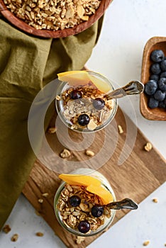 High angle view blueberry and peach granola parfait