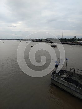 high angle view of boats moored in sungai musi against sky