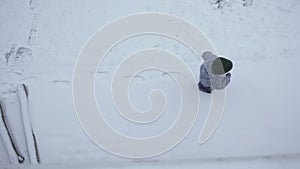 high angle view boy child gray overalls pure white snow kid leaves footprints