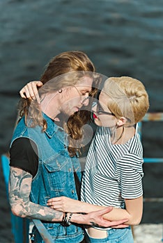 high angle view of boyfriend with tattoos and stylish girlfriend