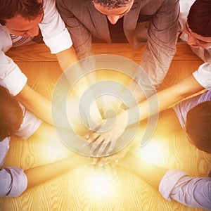 High angle view of business team stacking hands