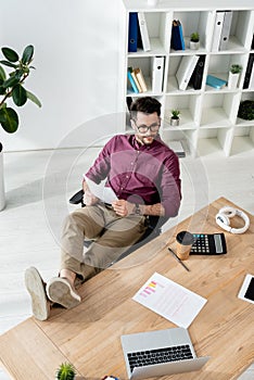 High angle view of businessman holding