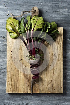 Raw beetroot on a rustic wooden table