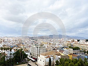high angle view of the city from Alcazaba de Malaga on a cloudy day. one of the most famous attractions in Malaga, Spain photo