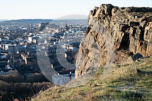 High angle view of the City of Edinburgh against skyline from cliffs of Salisbury Crags near Arthur\'s Seat