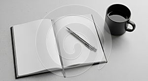 Blank Notebook and Pen with Coffee on a Minimalist Desk