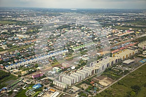 High angle view of condominium building and home village over outskirt of bangkok thailand capital