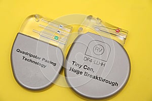 High angle view of an CRT-P device and and an ICD device.Image isolated on yellow background. photo