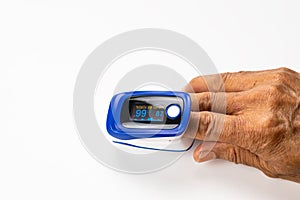 High angle view of doctor using pulse oximeter measured blood value of pulse rate and value of oxygen saturation at the finger tip