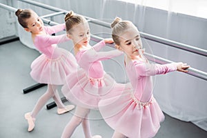 high angle view of elegant little ballerinas dancing