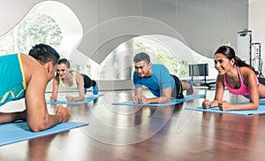 High-angle view of a fitness instructor during group calisthenics class