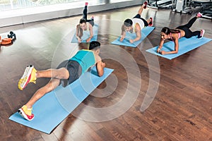 High-angle view of a fitness instructor during group calisthenics