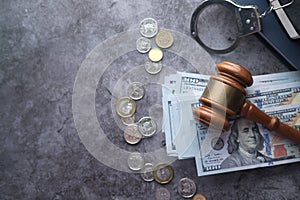 High angle view of gavel and cash on table