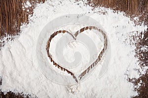 High Angle View Of Heart Drawn On Flour