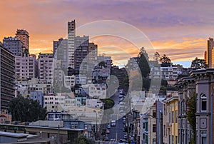 High angle view of homes on the famous crooked Lombard Street, San Francisco California with fiery skies at sunset