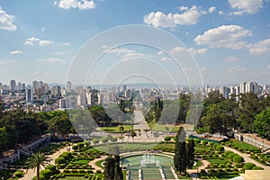 high angle view of Ipiranga Museum garden and fountains with Sao Paulo cityscape as backdrop, Brazil