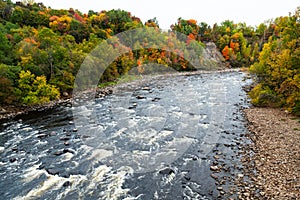 High angle view of the Jacques-Cartier River seen flowing between wooded banks