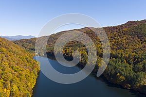 High angle view of Lake Logan and vibrant autumn colors in the Blue Ridge Mountains of North Carolina, USA