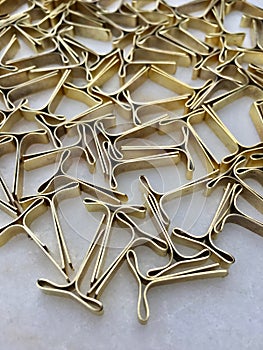 High angle view of locking clips for envelopes