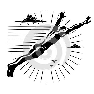 High angle view of a man diving in midair .