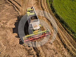 High Angle View modern combine harvester at the harvesting the wheat