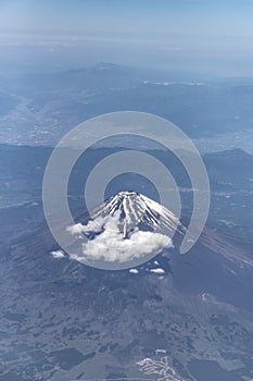 high angle view of mount Fuji from airplane. Highest volcano mountain in Japan