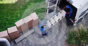 High Angle View Of Mover In Uniform Unloading Furniture
